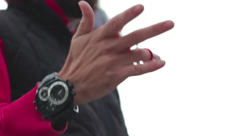 Slow motion of a barber spinning his scissors outside Video stock 147200815