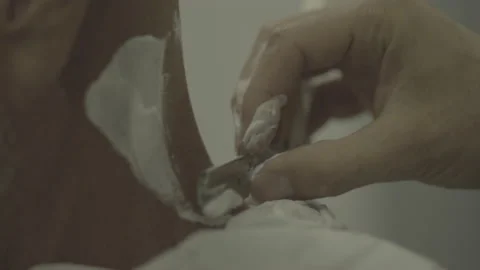 Slow motion barber using straight razor on clients neck. s-log prores 422 Stock Footage 236415040
