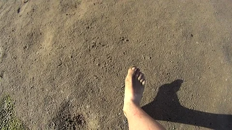 Slow motion of bare feet walking on sand on beach Stock Footage 51537982