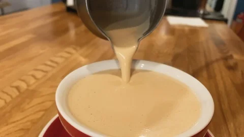 Slow motion. Barista working. The process of making coffee. Barista pours coffee Stock Footage 123553154