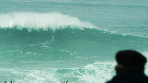 Slow Motion of barrel wave breaking into itself with surfers surfing around Stock Footage 163264860