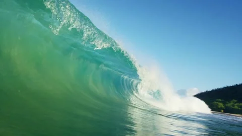 Slow motion barreling wave breaking and splashing, raw natural wonders Open Video stock 336585767
