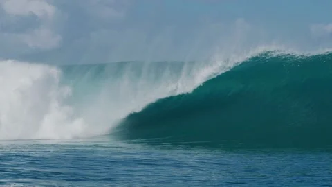 Slow motion barreling wave breaking and splashing, raw natural wonders Open Video stock 336585822