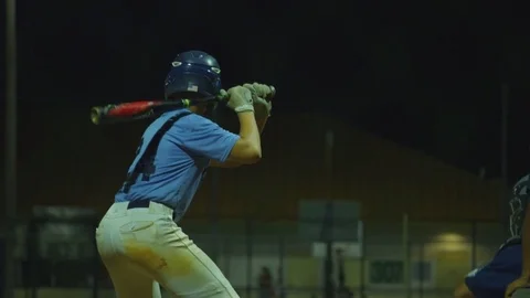 Slow Motion of baseball player almost swinging at ball at home plate Stock Footage 82340874