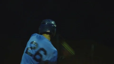 Slow Motion of baseball player batting and running to first base at game Stock Footage 82340722