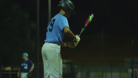 Slow motion of baseball player getting ready to bat at home plate Stock Footage 82341102