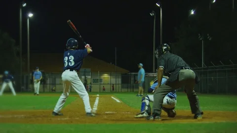 Slow motion of baseball player hitting  ball, running to first base during game Stock Footage 82444910