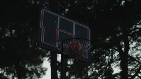 Slow motion of basket ball thrown into the basket Stock Footage 136928098