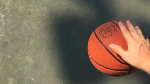 Slow motion of basketball bouncing on a playground Stock Footage 143943424