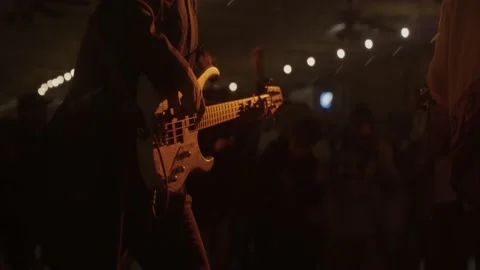 Slow motion bass player performing at live concert / music festival Stock Footage 210249237