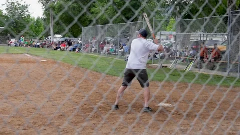 Slow motion-Batter connects for double during coed soft ball tournament Video stock 202805507