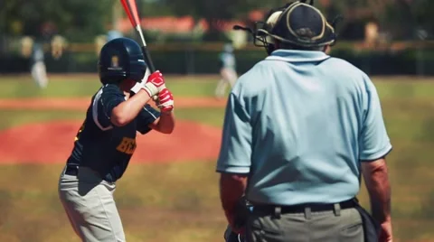 Slow motion of batter hitting ball and running to first during a baseball game Stock Footage 61268024