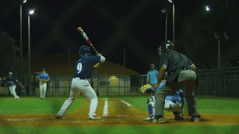 Slow motion of batter running to first after being walked by pitcher Stock Footage 82356058