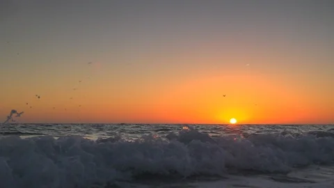 Slow-motion beach waves with warm sunset or sunrise Stock Footage 112030949