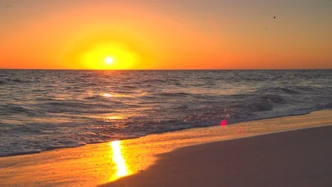 Slow motion beach waves with warm sun set or sunrise Stock Footage 112031232