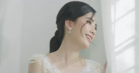 Slow Motion Beautiful Asian Bride Looking Out The Window. Stock Footage 155344522