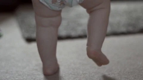 Slow Motion Beautiful Baby Boy Learning to Walk in HD Stock Footage