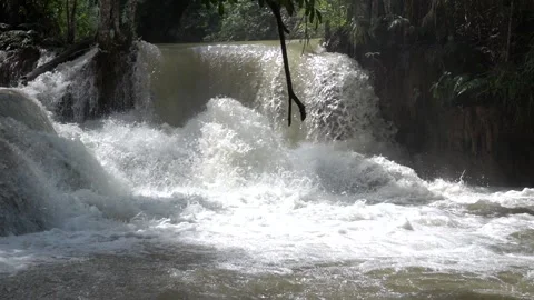 Slow motion of Beautiful Clear Waterfall Cascade In Tropical Rainforest Stock Footage 255030690