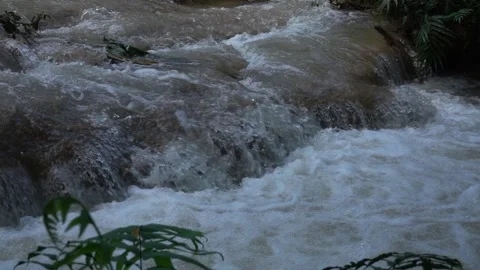 Slow motion of Beautiful Clear Waterfall Cascade In Tropical Rainforest Stock Footage 255030712