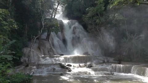 Slow motion of Beautiful Clear Waterfall Cascade In Tropical Rainforest Stock Footage 255031338