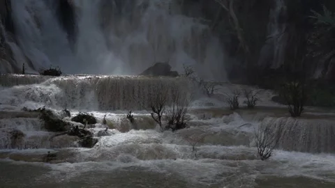 Slow motion of Beautiful Clear Waterfall Cascade In Tropical Rainforest Stock Footage 255031346