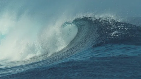 SLOW MOTION: Beautiful deep blue tube wave in the Pacific curls on a sunny day. Stock Footage 92039702