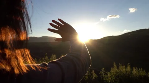 Slow motion of the beautiful girl looking at sun Stock Footage