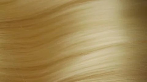 Slow motion of beautiful long smooth straight blond hair extension texture Stock Footage 134457410