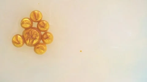 Slow motion beautiful macro surface with golden paint bubbles. Stock Footage 273777011