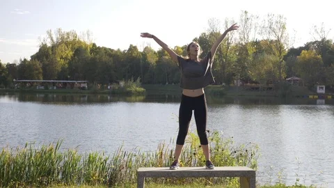 Slow motion beautiful slim good looking young woman working out up on a bench Stock Footage 83315936