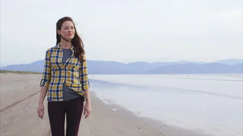 Slow motion beautiful woman walking on beach Stock Footage 59082475