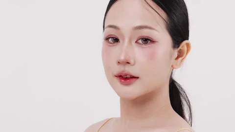 Slow motion of beautiful young Asian girl with k-beauty make up style. Stock Footage 338427573