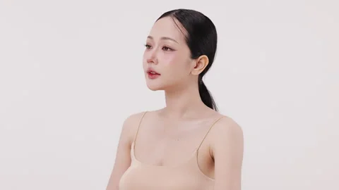 Slow motion of beautiful young Asian girl with k-beauty make up style. Stock Footage 338427739