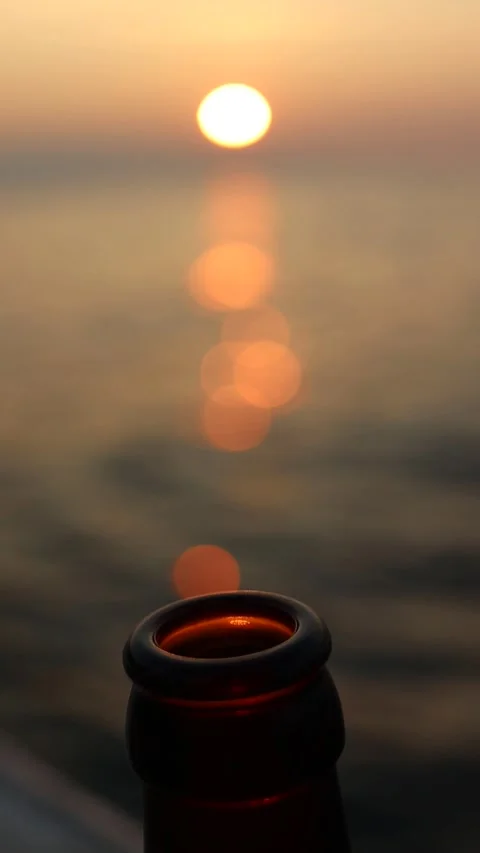 Slow Motion Beer Bottle on Sunset (Vertical) Stock Footage 245455940