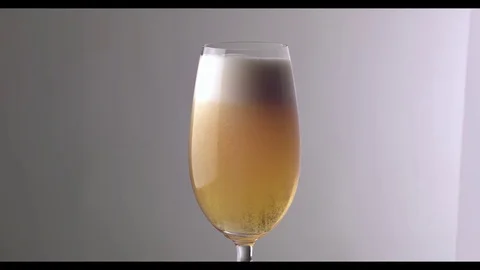 Slow Motion  Beer Foam Overflows Over The Edge Of The Glass Stock Footage 81794258