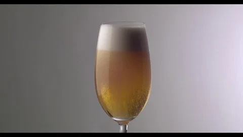 Slow Motion  Beer Foam Overflows Over The Edge Of The Glass Stock Footage 81794880