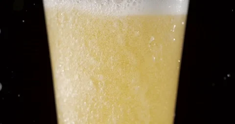 Slow Motion Beer Splash Reveals Dynamic Foam and Bubbles Rising Stock Footage 340079021