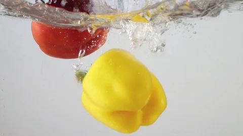 Slow motion Bell Pepper  with water splash and white background. Stock Footage 106003284