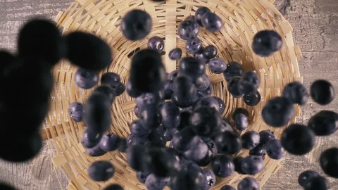 Slow motion berries fall into the basket on the table top view Stock Footage 92951902