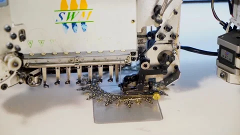 Slow motion big close upshot of automatic embroidery machine with multiple h Stock Footage 199270971