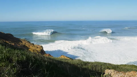 Slow motion of big ocean waves arising from ocean water surface foaming up Stock Footage 155794596