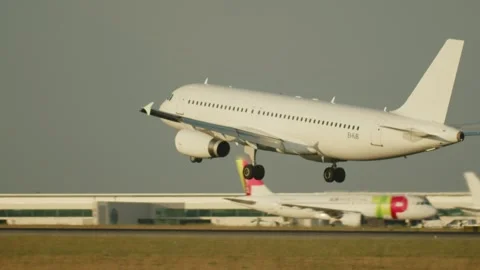 Slow-motion of a big passenger plane landing on the runway in airport. Stock Footage 304101327