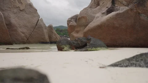 Slow motion Big Rocks on sandy beach on Curieuse island Seychelles Stock Footage 313788165