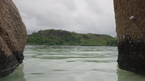 Slow motion Big Rocks on sandy beach on Curieuse island Seychelles Stock Footage 313788246