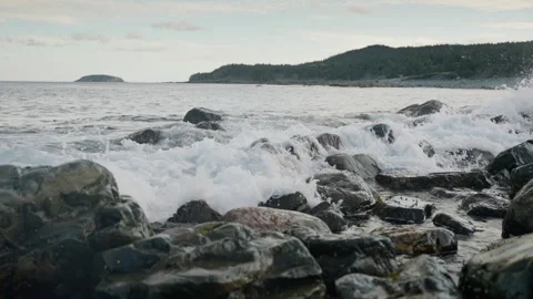 Slow Motion of Big Sea Waves Splashing on Rocks on the Coast, 4K Stock Footage 258397185