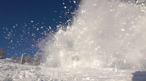 SLOW MOTION: Big snow avalanche sliding down a mountainside and into camera Stock Footage