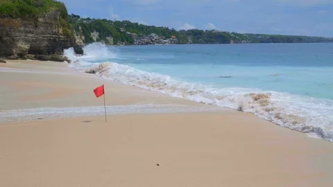 Slow motion of big tide waves are crushing on sand during hot day Video stock 115018933