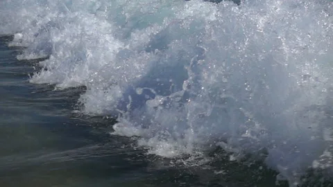 Slow motion big wave with splashes rolls on shore Stock Footage 112942356
