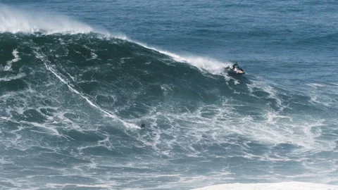 Slow motion of a big wave surfer Kai Lenny from Hawaii riding a monster Stock Footage 142461515