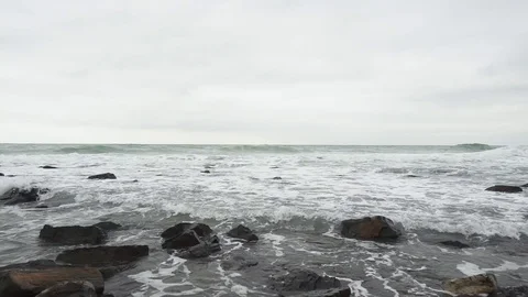 Slow motion big waves in the sea and small on the beach Stock Footage 83210314